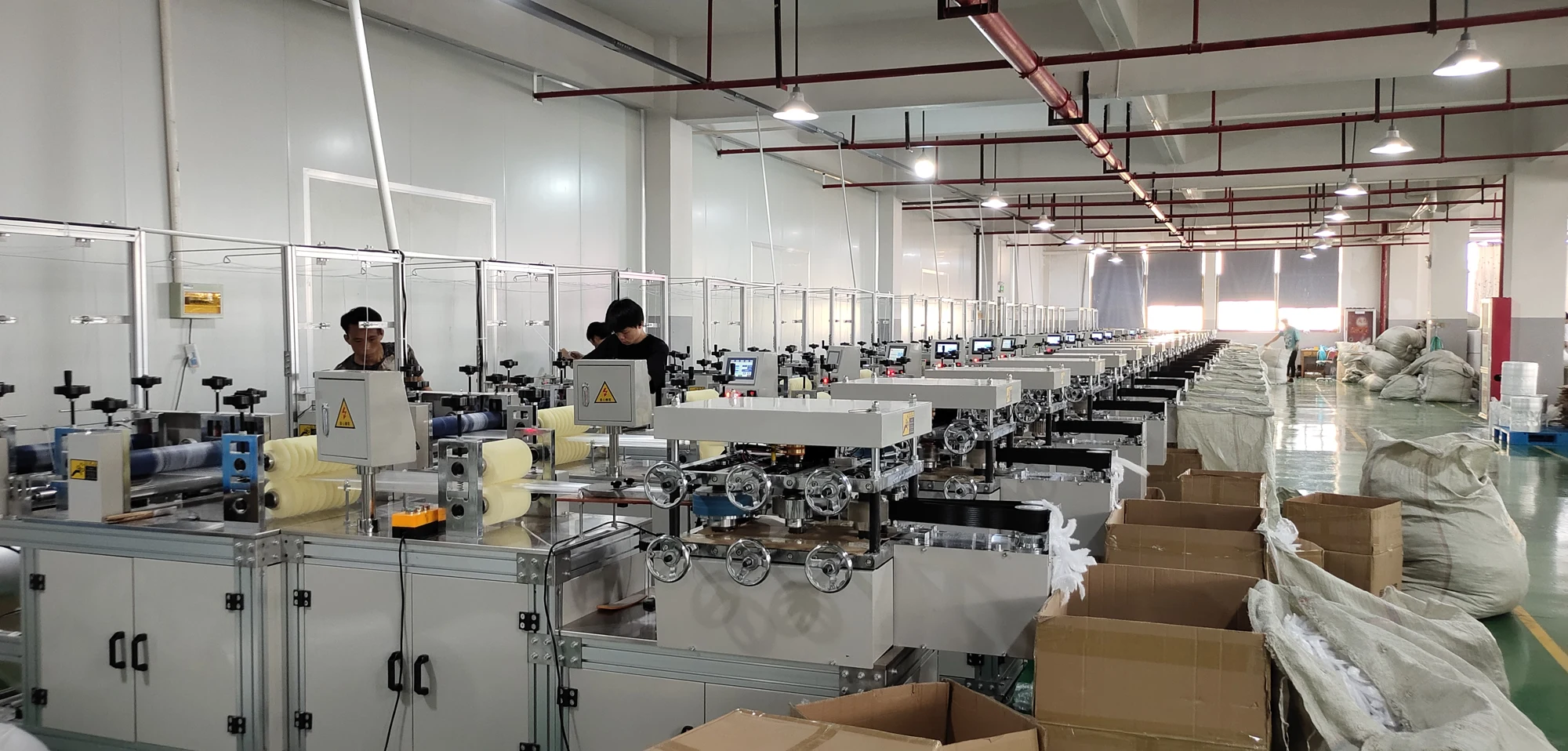 Staff and equipment on the LuKang production floor